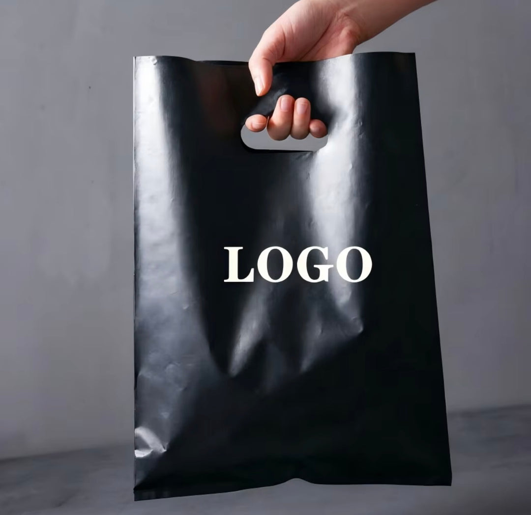 Black plastic shopping bag with example white logo